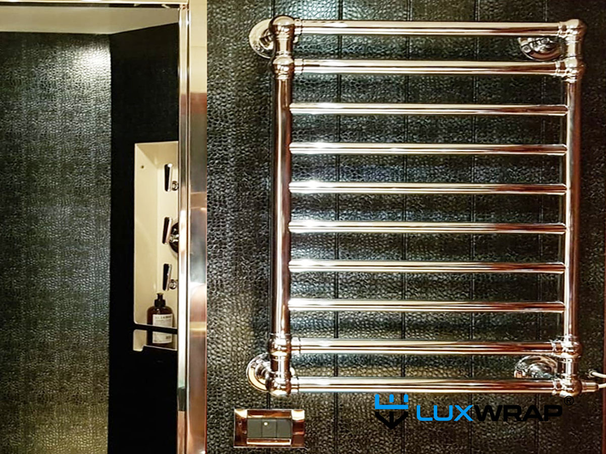 Superyacht bathroom panels wrapped in alligator-skin texture architectural film