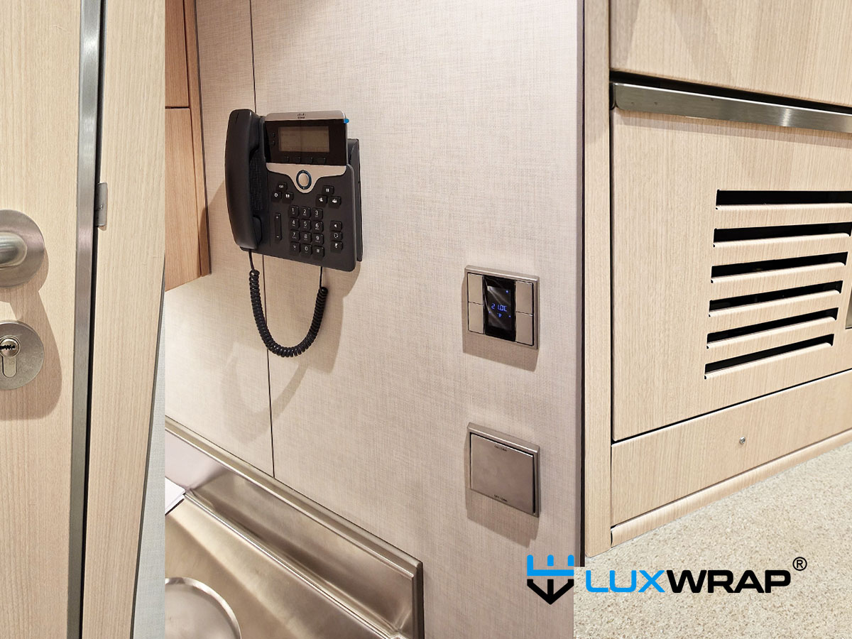 Superyacht interior transformation using wood and textile architectural wrap films