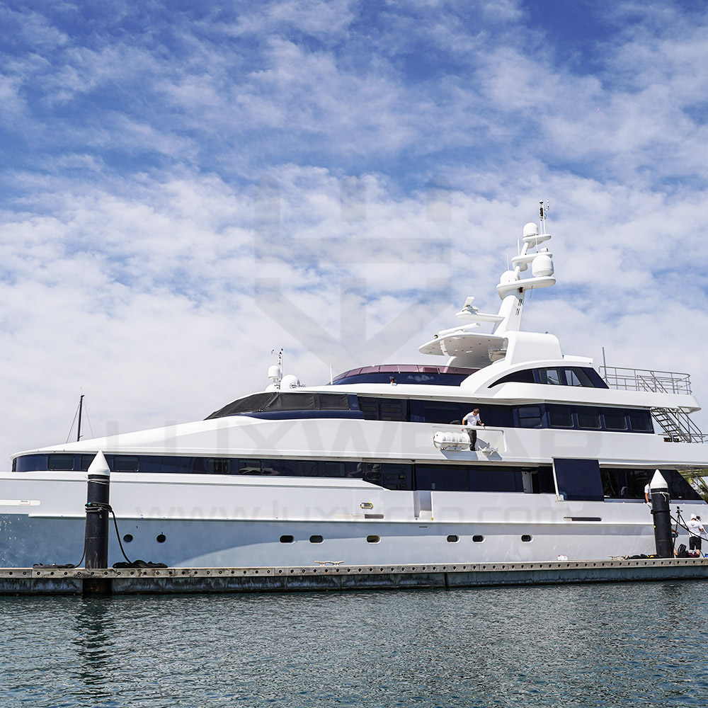 Close-up of metallic white vinyl wrap application on a 43m Heesen hull — precision fit by LuxWrap