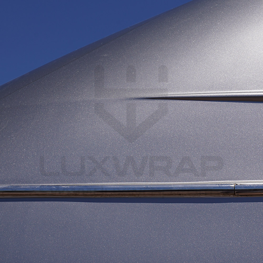 47m Swiftships superyacht mid-wrap — anthracite hull and silver superstructure vinyl installation by LuxWrap