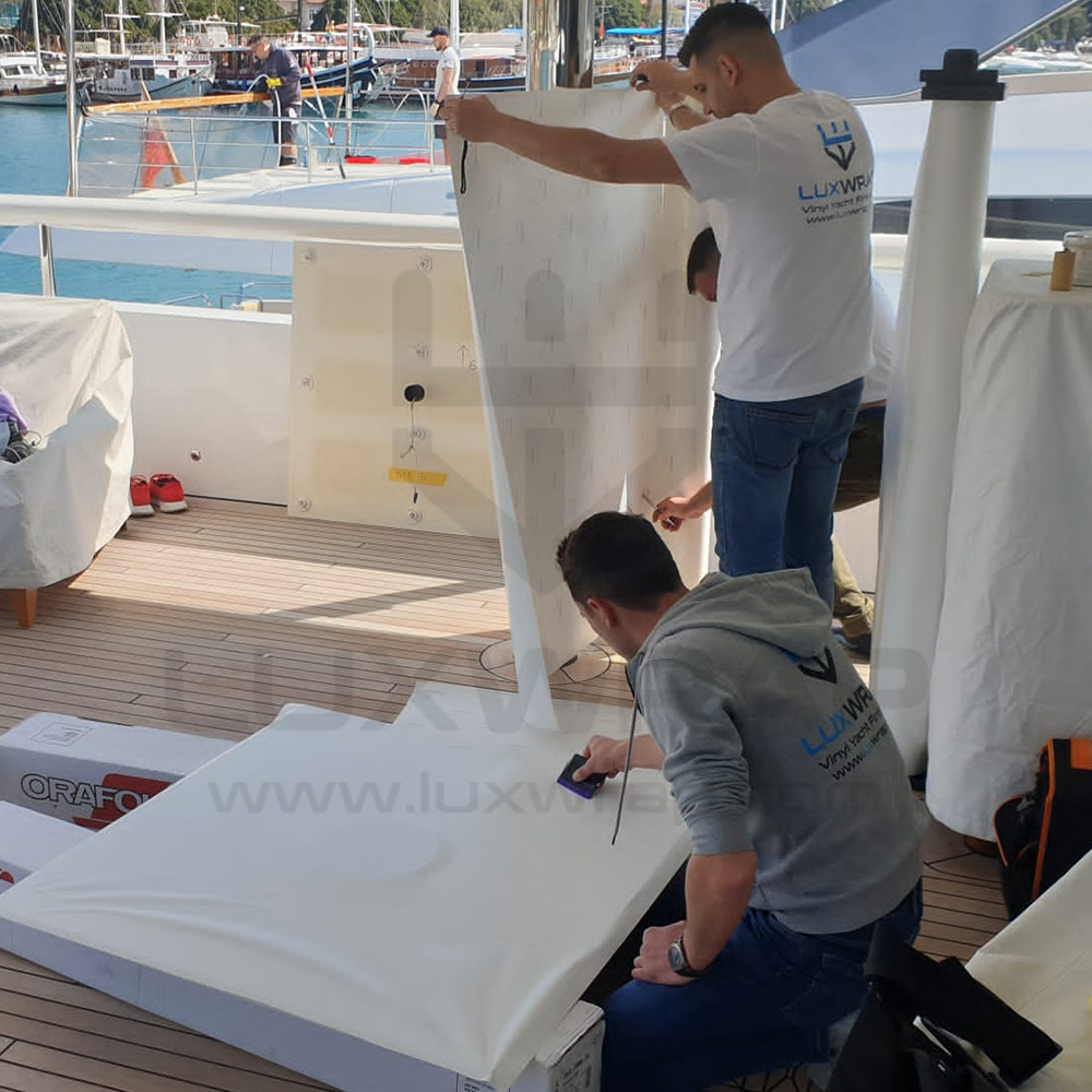 Satin-white deckhead wrap on a 57m Benetti superyacht — 280m² of overhead panels wrapped by LuxWrap in 7 days