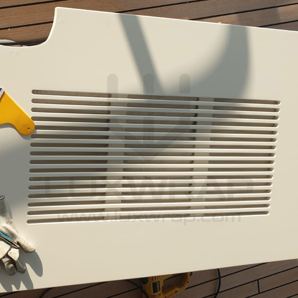 Close-up of satin-white vinyl deckhead wrap on a 57m Benetti superyacht — LuxWrap no-mess alternative to painting