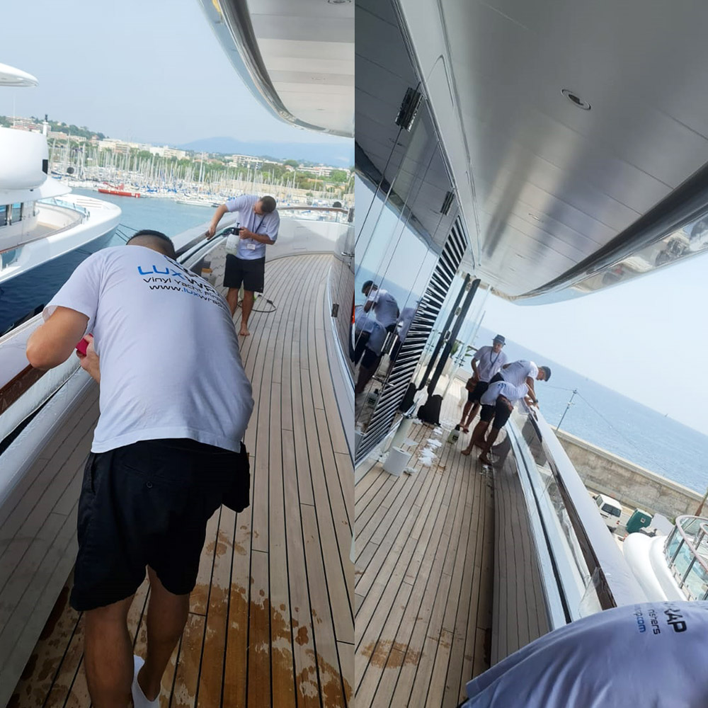Completed high-gloss PPF cap rail wrap on a 96m Feadship superyacht by LuxWrap — finish exceeding the gloss level of original varnish